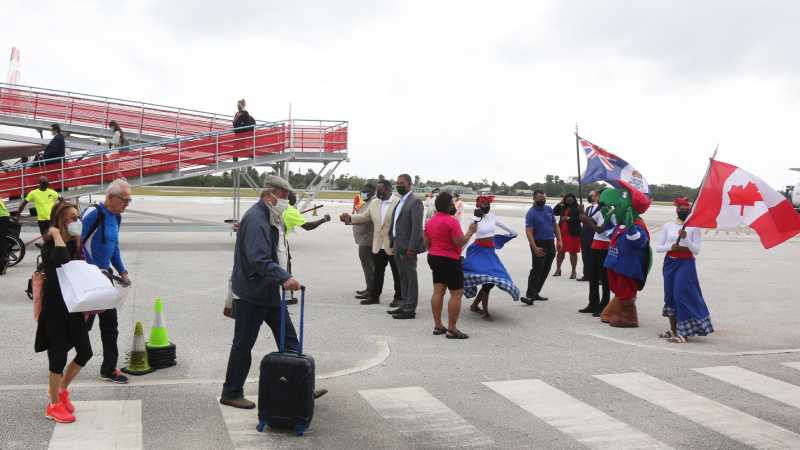 Canadians welcomed near the runway of GCM.