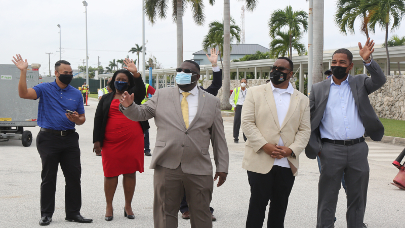Cayman Islands officials welcoming guests.
