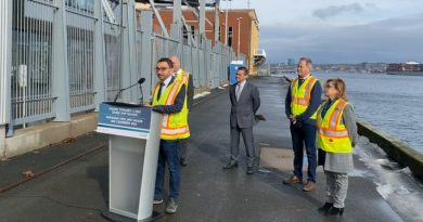 Transport Minister Omar Alghabra and officials from the Port of Halifax.