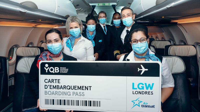 Air Transat crew members celebrating the new YQB to LGW route.