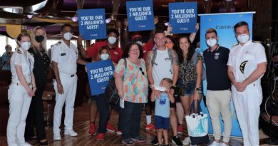 The Gibbs family boards Carnival Freedom in Port Canaveral, Florida, as Carnival Cruise Line's 2 millionth guests since its restart.