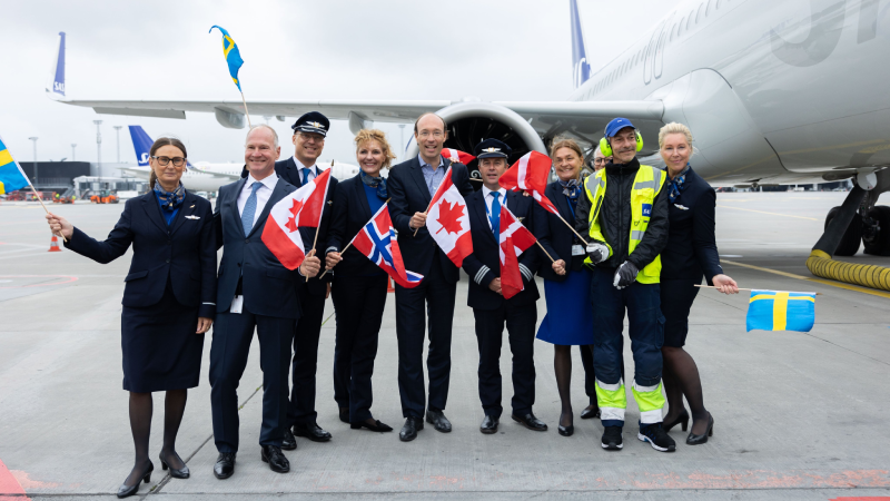 SAS executives and crew members celebrating the airline's inaugural flight from CPH to YYZ on 02JUN.