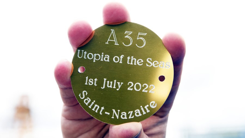 One of the newly minted coins Royal Caribbean placed on Utopia of the Seas' first 948-ton steel block.