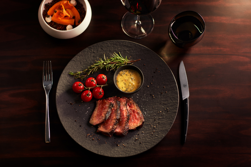 Explora Journeys' Marble & Co. Grill - Grilled prime rib, aged for 30 days, cherry tomatoes, Hollandaise Sauce