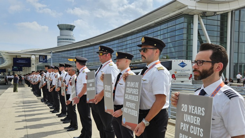 pilots stand in solidarity at person airport