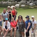 Group photos at Mossman Gorge. L-R Jennine Hamilton, Rosie, Michelle deKort, Lesley Houlder, Marj Valenzuela, Clementina Iannuzzi, Cindy Sedge, Carolyn MacKay, Karen Dahdah, Jamie Horwood, Deborah Hickey, Brooklyn Munson, Banerji Gloridason