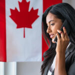 Canadian Travel Agent at a Desk